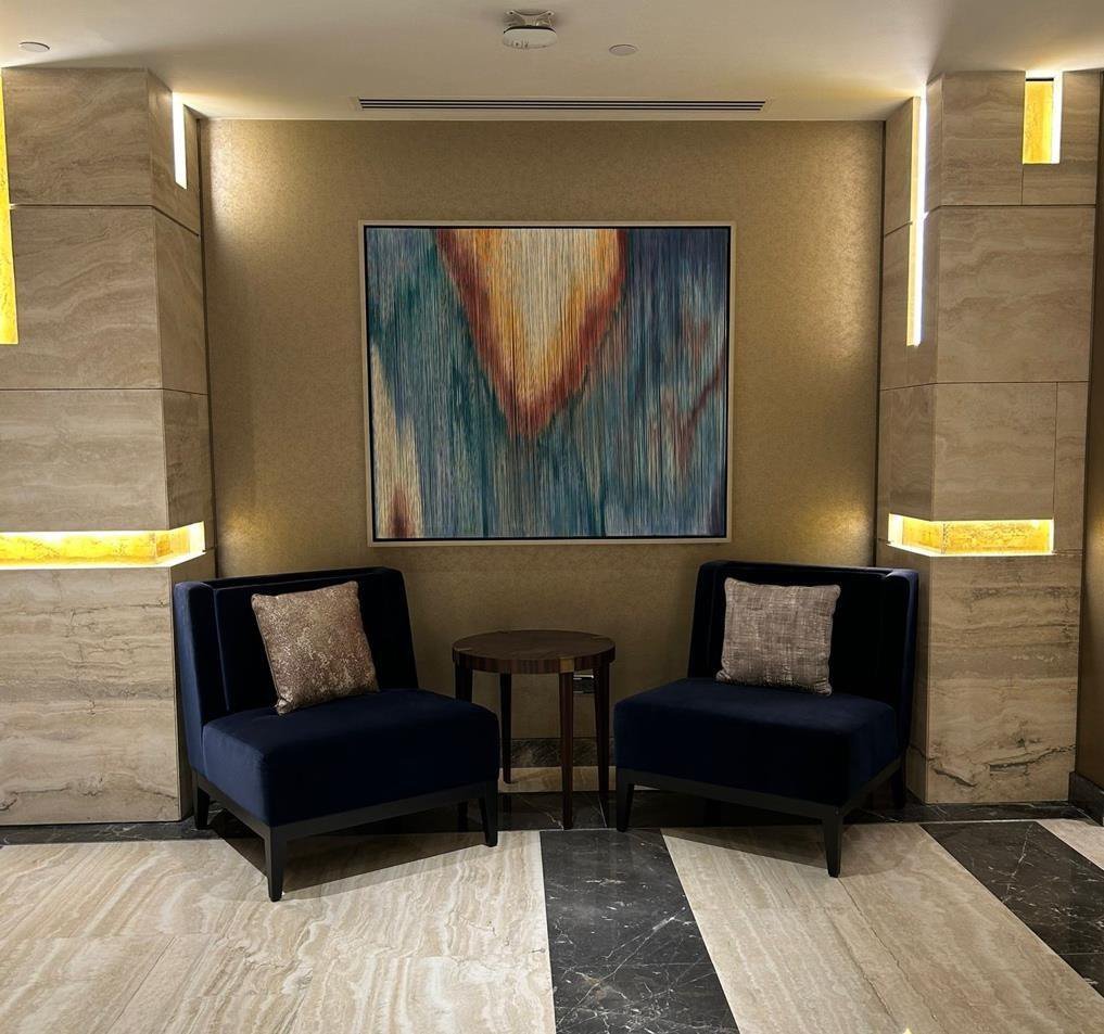 A hospitality space with artwork placed by The Artemist, Kolkata